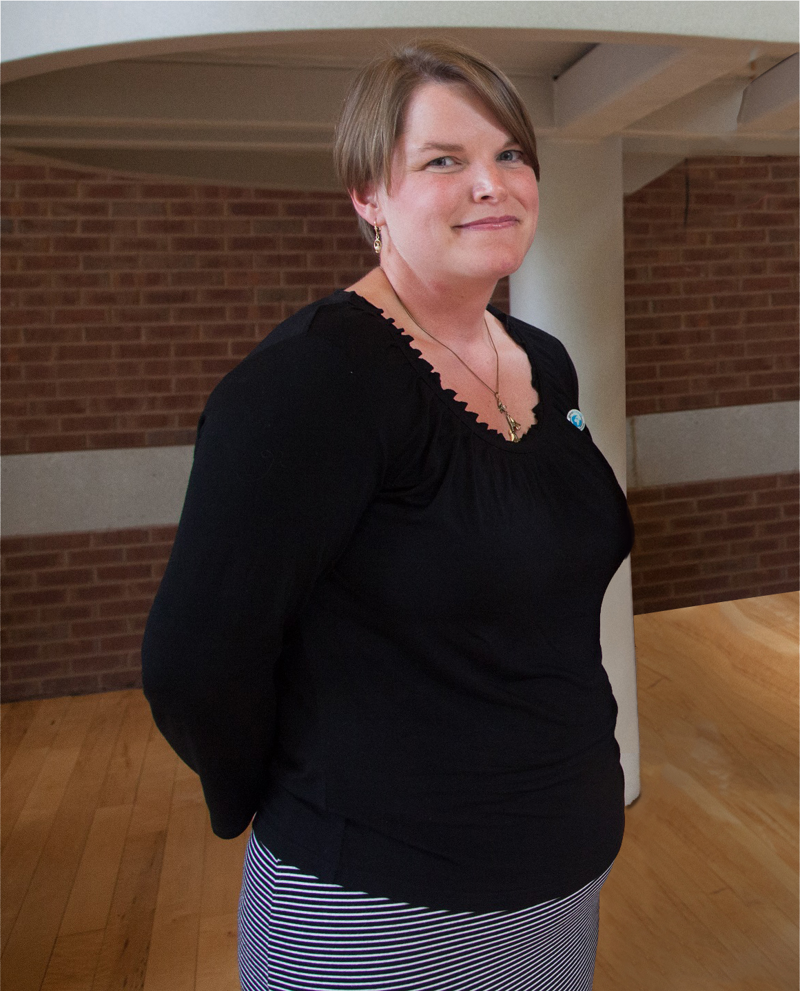 Amanda Bennett poses in front of stairwell of the CBIH building.