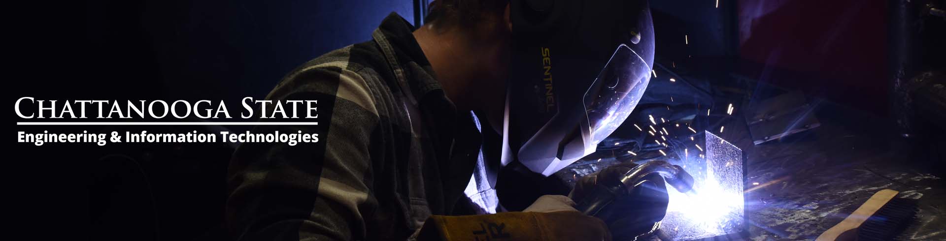 photo of person welding