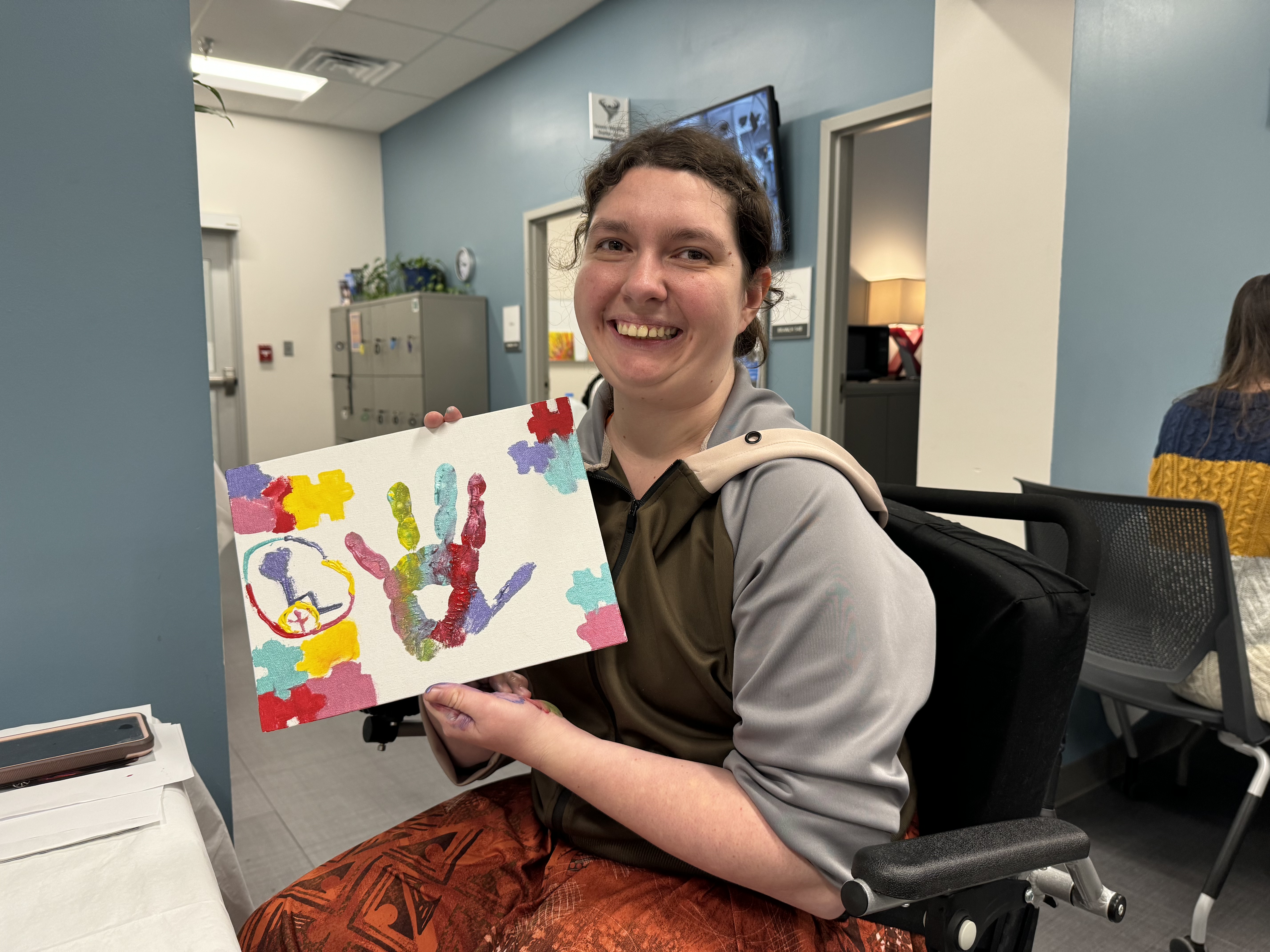Student Alisha K. holds up her vision board. Student Alisha K. holds up her vision board.