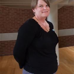 Amanda Bennett poses in front of stairwell of the CBIH building.