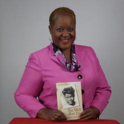 Pictured, Linda Murray Bullard –alum, writer, speaker, entrepreneur--holding her book The Well Ran Dry