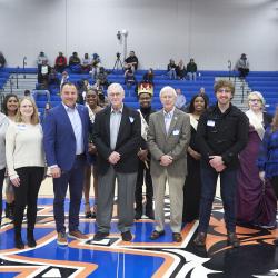 ChattState alumni stand with the ChattState Homecoming Court during Homecoming on Nov. 29, 2023.