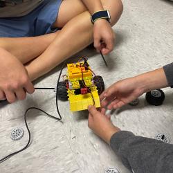 Two people work together to build a RoboThink robot. Two people work together to build a RoboThink robot.
