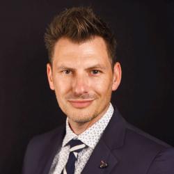 headshot of man in suit