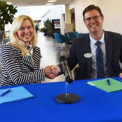 man and woman shaking hands