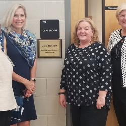 4 women in front of a classroom