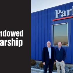 larry and robert parks in front of their company building