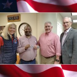 woman and three men against a flag background