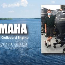 chattstate students with newly donated yamaha motor against a lake background