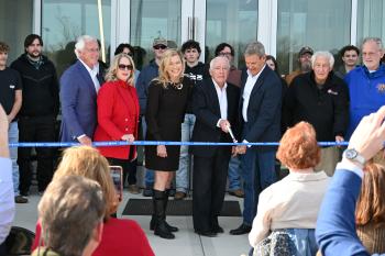Rhea County Ribbon Cutting People cutting a ribbon for a new building