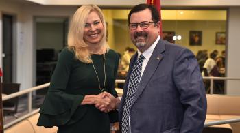dr ashford and dr mann shaking hands