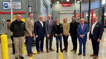 group of people in an auto body shop