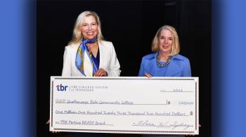 2 women holding an oversize check