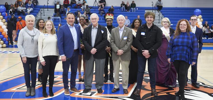 ChattState alumni stand with the ChattState Homecoming Court during Homecoming on Nov. 29, 2023.