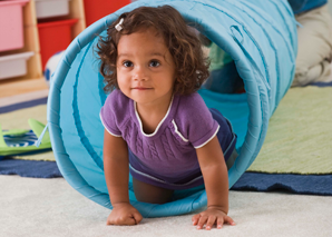 Toddler crawls out toy tunnel
